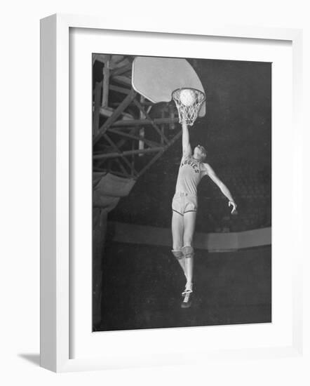 Texas A&M Basketball Player Bob Kurland Reaching to Make a Basket-Myron Davis-Framed Photographic Print