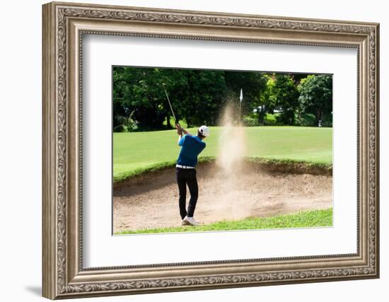 Thai Young Man Golf Player in Action Swing in Sand Pit during Practice before Golf Tournament at Go-Kitzero-Framed Photographic Print