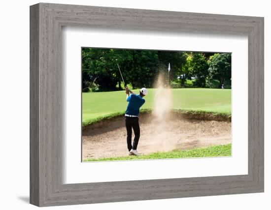 Thai Young Man Golf Player in Action Swing in Sand Pit during Practice before Golf Tournament at Go-Kitzero-Framed Photographic Print