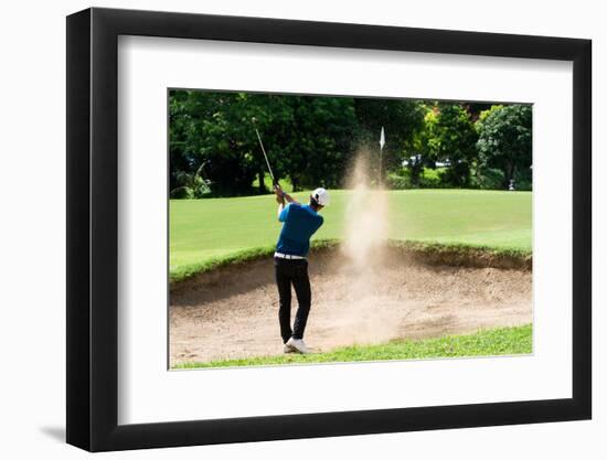 Thai Young Man Golf Player in Action Swing in Sand Pit during Practice before Golf Tournament at Go-Kitzero-Framed Photographic Print