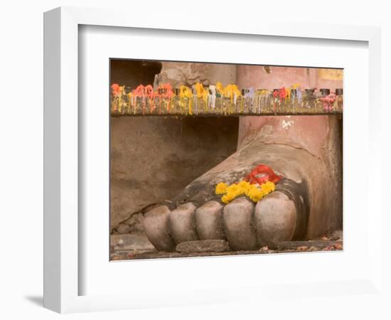 Thailand, Candle and marigold flowers at Buddha's feet-Gavriel Jecan-Framed Photographic Print