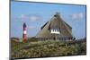 Thatched Roof House in the 'Kersig-Siedlung' of Hšrnum in Front of the Lighthouse-Uwe Steffens-Mounted Photographic Print