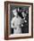 The 21 Club's Jack Kriendler Wearing a Tuxedo and Conferring with a Chef in the Club's Kitchen-null-Framed Photographic Print