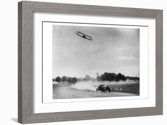 The Airplane Races the Automobile-null-Framed Art Print