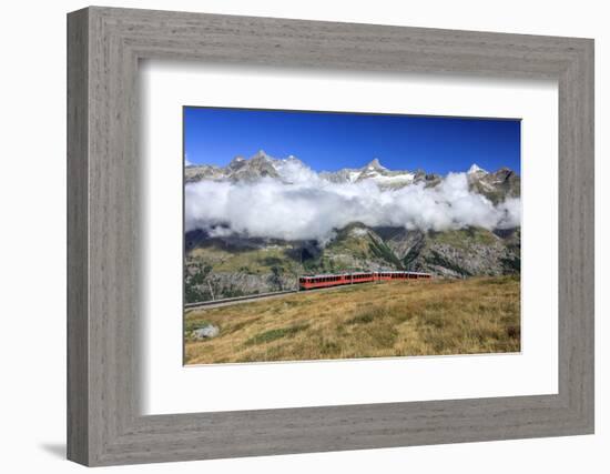 The Bahn Train on its Route with High Peaks and Mountain Range in the Background, Switzerland-Roberto Moiola-Framed Photographic Print