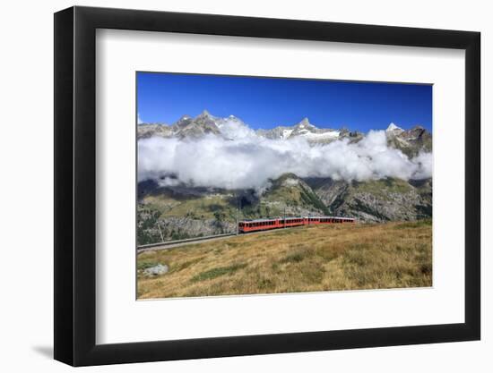 The Bahn Train on its Route with High Peaks and Mountain Range in the Background, Switzerland-Roberto Moiola-Framed Photographic Print