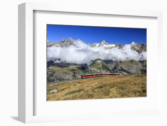 The Bahn Train on its Route with High Peaks and Mountain Range in the Background, Switzerland-Roberto Moiola-Framed Photographic Print