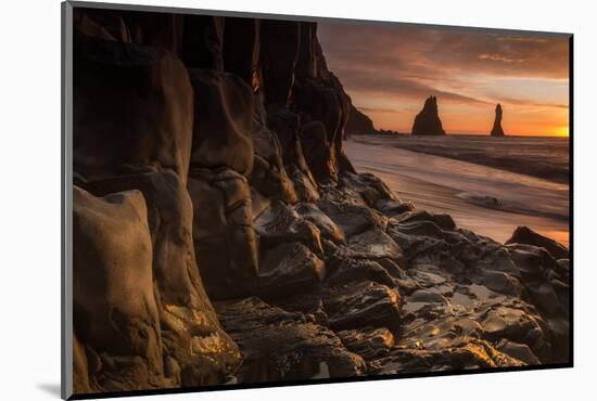 The basalt rock formations in the sea on Reynisfjara Beach in Vik, Iceland at sunrise.-Alex Saberi-Mounted Photographic Print