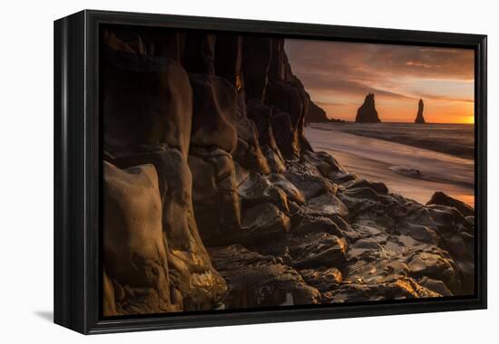 The basalt rock formations in the sea on Reynisfjara Beach in Vik, Iceland at sunrise.-Alex Saberi-Framed Premier Image Canvas