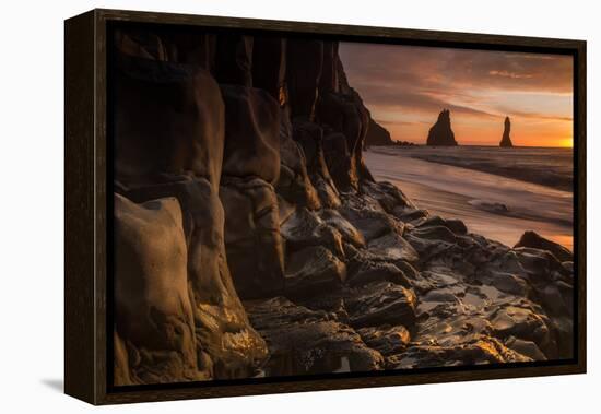 The basalt rock formations in the sea on Reynisfjara Beach in Vik, Iceland at sunrise.-Alex Saberi-Framed Premier Image Canvas