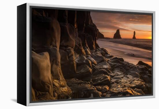 The basalt rock formations in the sea on Reynisfjara Beach in Vik, Iceland at sunrise.-Alex Saberi-Framed Premier Image Canvas