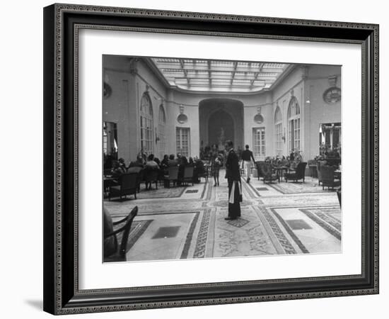 The Bellhop Standing at the Entrance of the Swank Hotel Ritz-Dmitri Kessel-Framed Photographic Print