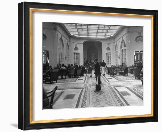 The Bellhop Standing at the Entrance of the Swank Hotel Ritz-Dmitri Kessel-Framed Photographic Print