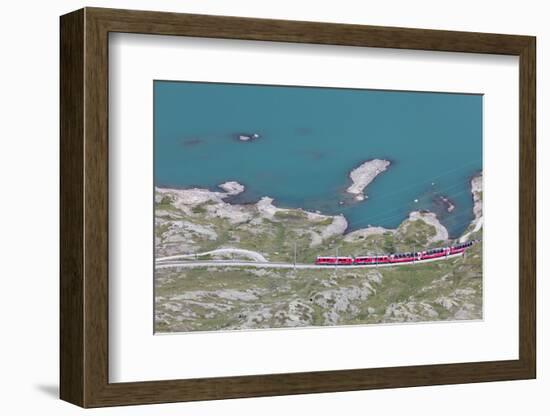 The Bernina Express train passes on the shores of Lago Bianco, Bernina Pass, Canton of Graubunden, -Roberto Moiola-Framed Photographic Print