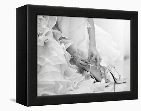 The Bride is Putting on Her Shoes for the Wedding Day-szefei-Framed Premier Image Canvas