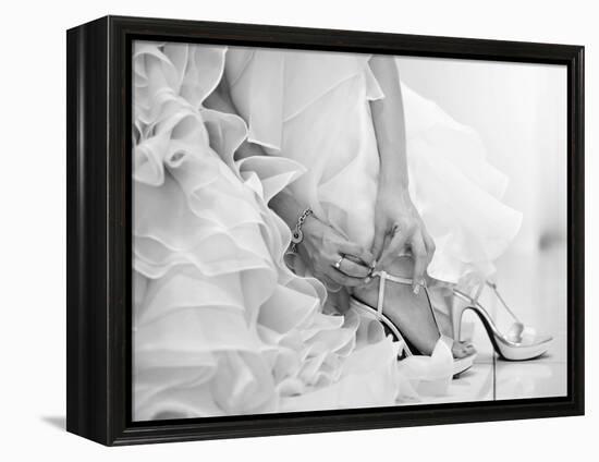 The Bride is Putting on Her Shoes for the Wedding Day-szefei-Framed Premier Image Canvas