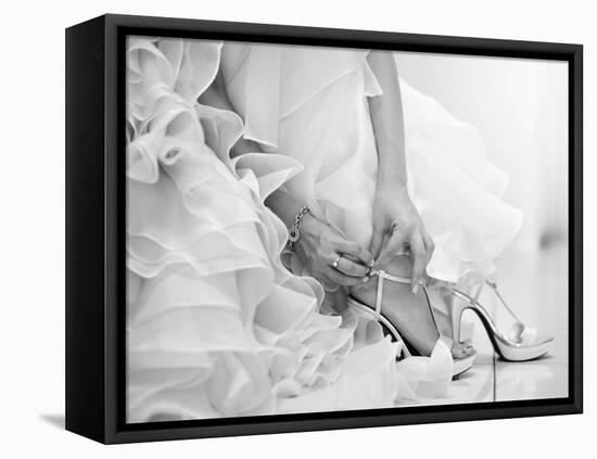 The Bride is Putting on Her Shoes for the Wedding Day-szefei-Framed Premier Image Canvas