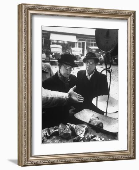 The Butcher Rationing the Amount of Meat Sold to the Customers Because of the Postwar Meat Shortage-Cornell Capa-Framed Photographic Print