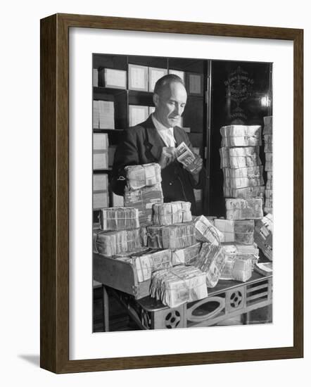 The Chief Cashier Counting Piles of Money-Walter Sanders-Framed Photographic Print