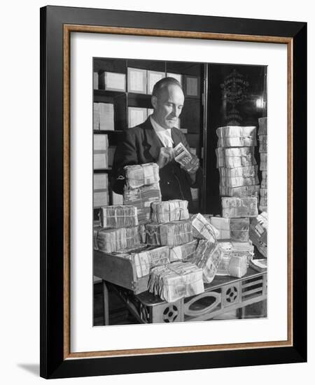 The Chief Cashier Counting Piles of Money-Walter Sanders-Framed Photographic Print