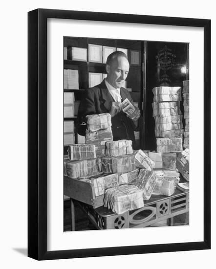 The Chief Cashier Counting Piles of Money-Walter Sanders-Framed Photographic Print