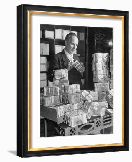 The Chief Cashier Counting Piles of Money-Walter Sanders-Framed Photographic Print