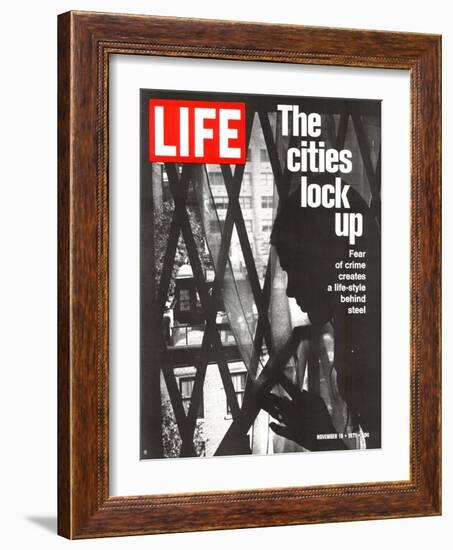 The Cities Lock Up, Woman at Gated Window, November 19, 1971-John Loengard-Framed Photographic Print