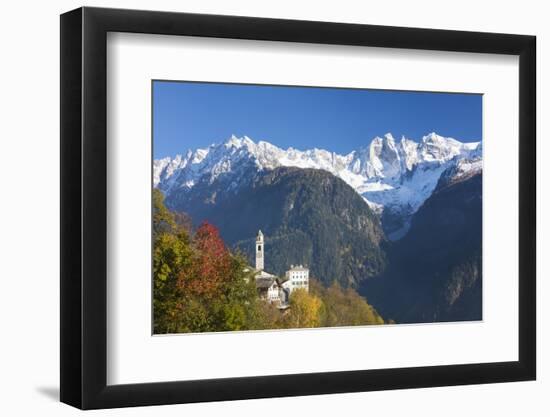 The colorful trees frame the alpine church and the snowy peaks, Soglio, Bregaglia Valley, Canton of-Roberto Moiola-Framed Photographic Print