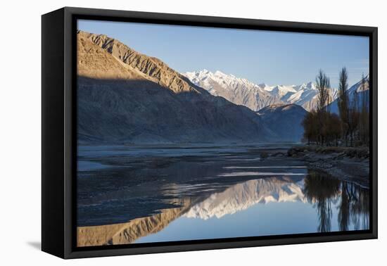 The crystal clear Shyok River creates a mirror image in the Khapalu valley near Skardu, Pakistan-Alex Treadway-Framed Premier Image Canvas