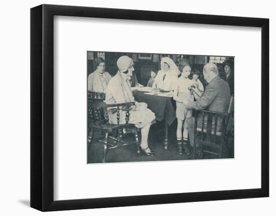 'The Doctor listening to a child's heart beat', c1935-Unknown-Framed Photographic Print