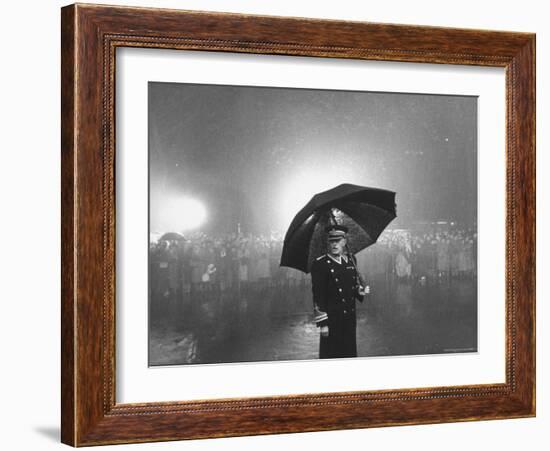 The Doorman Standing in the Rain Outside the Empire Theatre For the Royal Film Performance-Cornell Capa-Framed Photographic Print
