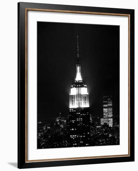 The Empire State Building Lights up at Night-null-Framed Photographic Print