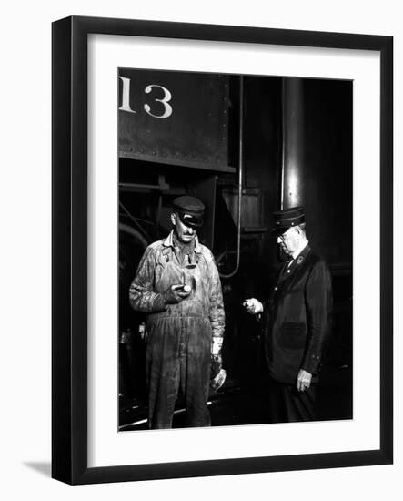 The Engineer and Conductor Checking Time-null-Framed Photographic Print