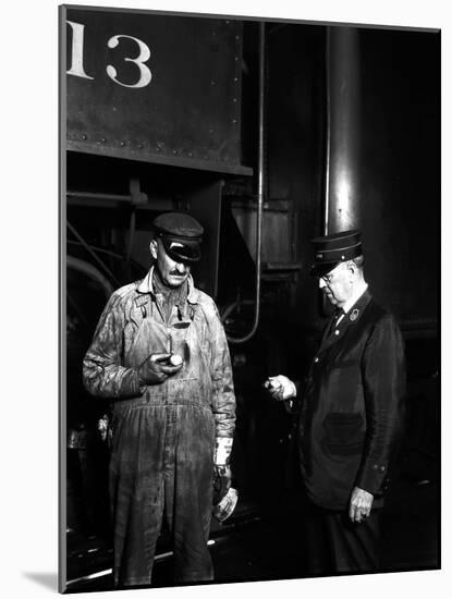 The Engineer and Conductor Checking Time-null-Mounted Photographic Print