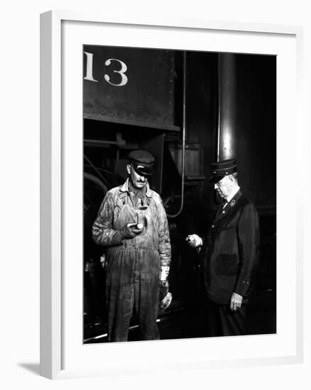 The Engineer and Conductor Checking Time-null-Framed Photographic Print