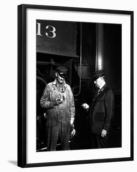 The Engineer and Conductor Checking Time-null-Framed Photographic Print