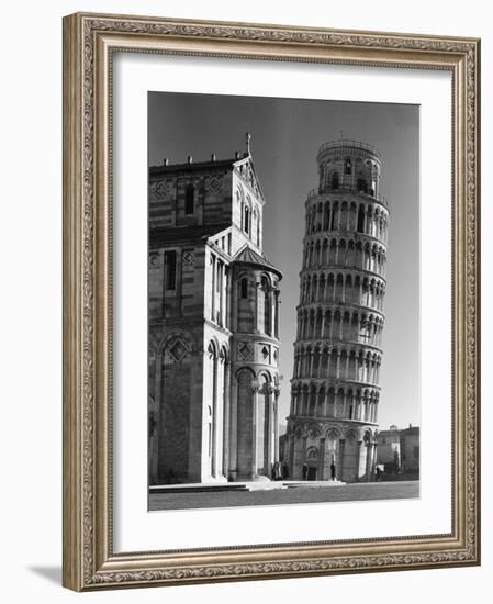 The Famed Leaning Tower of Pisa Standing Beside the Baptistry of the Cathedral-Margaret Bourke-White-Framed Photographic Print