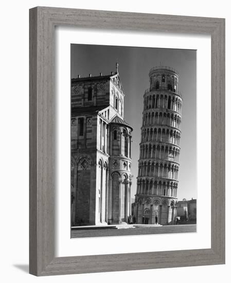 The Famed Leaning Tower of Pisa Standing Beside the Baptistry of the Cathedral-Margaret Bourke-White-Framed Photographic Print