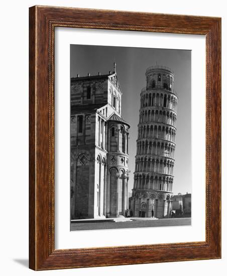 The Famed Leaning Tower of Pisa Standing Beside the Baptistry of the Cathedral-Margaret Bourke-White-Framed Photographic Print