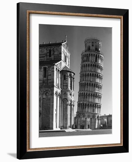 The Famed Leaning Tower of Pisa Standing Beside the Baptistry of the Cathedral-Margaret Bourke-White-Framed Photographic Print