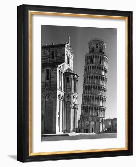 The Famed Leaning Tower of Pisa Standing Beside the Baptistry of the Cathedral-Margaret Bourke-White-Framed Photographic Print