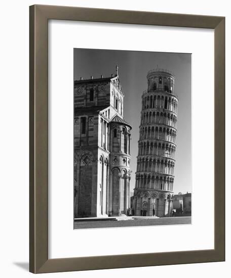 The Famed Leaning Tower of Pisa Standing Beside the Baptistry of the Cathedral-Margaret Bourke-White-Framed Photographic Print