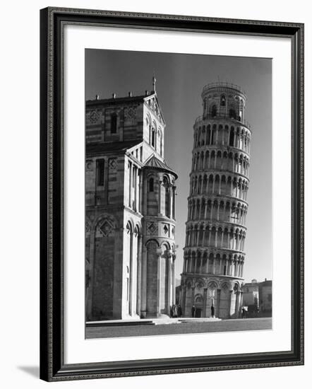 The Famed Leaning Tower of Pisa Standing Beside the Baptistry of the Cathedral-Margaret Bourke-White-Framed Photographic Print