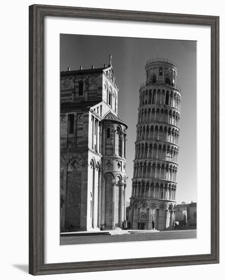 The Famed Leaning Tower of Pisa Standing Beside the Baptistry of the Cathedral-Margaret Bourke-White-Framed Photographic Print