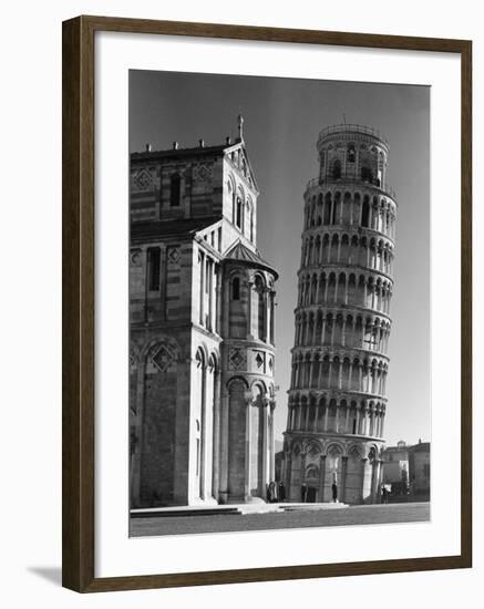 The Famed Leaning Tower of Pisa Standing Beside the Baptistry of the Cathedral-Margaret Bourke-White-Framed Photographic Print