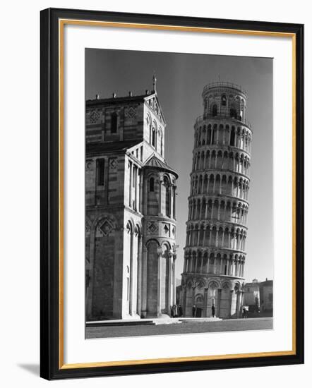 The Famed Leaning Tower of Pisa Standing Beside the Baptistry of the Cathedral-Margaret Bourke-White-Framed Photographic Print