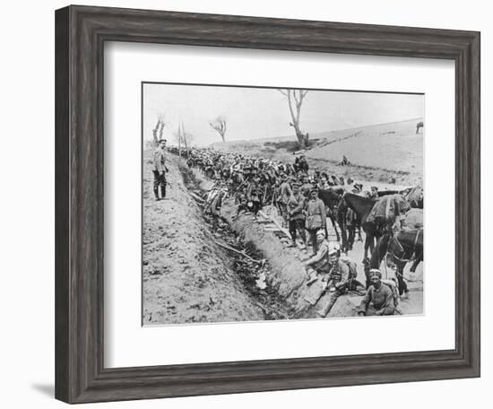 'The German advance through Galicia: A bivouac of troops by the roadside', 1915-Unknown-Framed Photographic Print