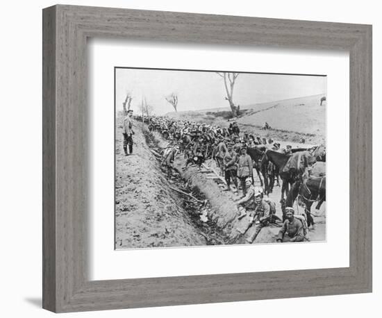 'The German advance through Galicia: A bivouac of troops by the roadside', 1915-Unknown-Framed Photographic Print