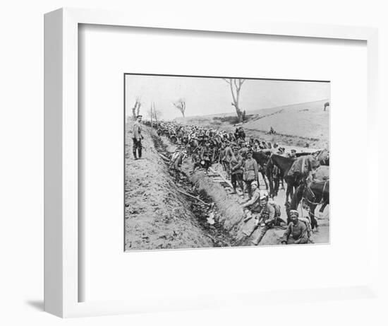 'The German advance through Galicia: A bivouac of troops by the roadside', 1915-Unknown-Framed Photographic Print
