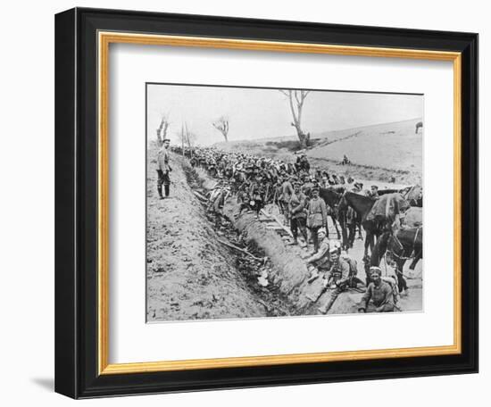 'The German advance through Galicia: A bivouac of troops by the roadside', 1915-Unknown-Framed Photographic Print